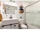 Bright bathroom featuring a white vanity, updated fixtures, and a shower with a frosted glass door at 1512 W Fairmont Dr, Tempe, AZ 85282