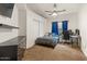 Bedroom with carpet flooring, a ceiling fan, a closet, and an area to set up a workstation at 15203 N 28Th Pl, Phoenix, AZ 85032