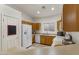 Well-equipped kitchen featuring wooden cabinets, white appliances, and ample counter space at 15203 N 28Th Pl, Phoenix, AZ 85032