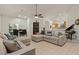 Spacious living room features tile floors, neutral colors, and a comfortable sectional sofa at 15203 N 28Th Pl, Phoenix, AZ 85032