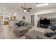 Bright and open living space with a kitchen view, complemented by tile flooring at 15203 N 28Th Pl, Phoenix, AZ 85032