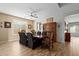 Open dining room showcasing wood-look floors, a china cabinet, and a light fixture at 15658 W Cortez St, Surprise, AZ 85379