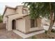 Attractive stucco home with a tile roof, arched entry, and well-kept landscaping at 15658 W Cortez St, Surprise, AZ 85379