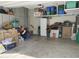 Organized garage featuring shelving and ample storage space for various items at 16648 W Jenan Dr, Surprise, AZ 85388