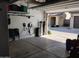 Clean garage with overhead door access showcasing space for parking and storage at 16648 W Jenan Dr, Surprise, AZ 85388