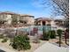 Community pool area with lounge chairs and a view of the clubhouse at 16648 W Jenan Dr, Surprise, AZ 85388