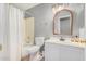 Cozy bathroom features a shower-tub combo and a white vanity at 1735 W Wildwood Dr, Phoenix, AZ 85045