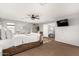 Neutral primary bedroom with carpet, ceiling fan, desk, and stylish decor at 1735 W Wildwood Dr, Phoenix, AZ 85045