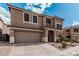 A two-story home featuring desert landscaping, a two-car garage and a covered front entry at 1735 W Wildwood Dr, Phoenix, AZ 85045