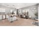 Bright kitchen and dining area featuring an island, stainless steel appliances, and modern decor at 1735 W Wildwood Dr, Phoenix, AZ 85045