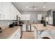 Bright kitchen featuring stainless appliances, white cabinets, and tiled countertops at 1735 W Wildwood Dr, Phoenix, AZ 85045