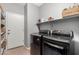 Well-organized laundry room features modern appliances at 1735 W Wildwood Dr, Phoenix, AZ 85045