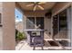 Covered patio has a fan, outdoor furniture, and a view of the backyard at 1735 W Wildwood Dr, Phoenix, AZ 85045