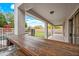 Back patio features a built-in bar, sink, lounge, and views of a pool and putting green for outdoor enjoyment at 17771 W Caribbean Ln, Surprise, AZ 85388