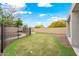 A beautifully landscaped backyard featuring a well-maintained putting green at 17771 W Caribbean Ln, Surprise, AZ 85388