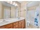 Bathroom boasts a double sink vanity and a separate shower/tub space at 17771 W Caribbean Ln, Surprise, AZ 85388