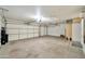 Spacious two car garage with neutral color palette and ample lighting at 18097 W Santa Alberta Ln, Goodyear, AZ 85338