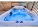 Hot tub featuring clear blue water and integrated lighting at 18097 W Santa Alberta Ln, Goodyear, AZ 85338