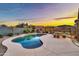 Backyard pool with beautiful sunset views and outdoor seating at 18097 W Santa Alberta Ln, Goodyear, AZ 85338