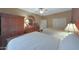 Inviting bedroom with two beds and ample closet space. Features wooden furniture at 18670 N Rincon Ct, Surprise, AZ 85387