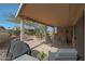 Spacious covered patio with ample seating and outdoor kitchen area at 18670 N Rincon Ct, Surprise, AZ 85387