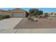 Charming single-story home with desert landscaping, two-car garage, and extended driveway at 18670 N Rincon Ct, Surprise, AZ 85387