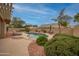 This backyard features a pool, desert landscaping and plenty of space to relax at 18730 N 89Th Ave, Peoria, AZ 85382