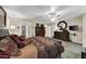 Spacious bedroom featuring plush carpet, a ceiling fan, and neutral paint at 18730 N 89Th Ave, Peoria, AZ 85382