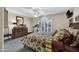 Bedroom with plush carpet, a ceiling fan, and natural light at 18730 N 89Th Ave, Peoria, AZ 85382