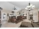 Elegant living room with high ceilings, a ceiling fan, and a neutral color palette at 18730 N 89Th Ave, Peoria, AZ 85382