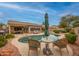 Backyard pool and patio area with seating and desert landscaping at 18730 N 89Th Ave, Peoria, AZ 85382