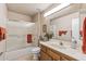 Bathroom featuring vanity with sink, toilet, and shower with glass door at 19503 N 142Nd Dr, Sun City West, AZ 85375