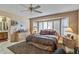 Bedroom with natural light, tile flooring, and neutral paint at 19503 N 142Nd Dr, Sun City West, AZ 85375