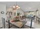 Open-concept dining area with seamless flow into the living room provides ample space at 19503 N 142Nd Dr, Sun City West, AZ 85375