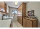 Laundry room featuring ample storage space, a window and modern appliances at 19503 N 142Nd Dr, Sun City West, AZ 85375