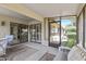 Covered patio with seating area, perfect for relaxing outdoors at 19503 N 142Nd Dr, Sun City West, AZ 85375