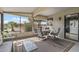 Enclosed patio with seating area offers an outdoor space at 19503 N 142Nd Dr, Sun City West, AZ 85375