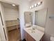 Bathroom with a large vanity, and a view into the walk-in closet in a cozy home at 19820 N 13Th Ave # 241, Phoenix, AZ 85027