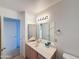 Bathroom featuring a large mirror, vanity, and good lighting at 19820 N 13Th Ave # 241, Phoenix, AZ 85027