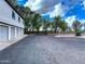 Exterior community parking area with multiple garages and drought resistant landscaping at 19820 N 13Th Ave # 241, Phoenix, AZ 85027