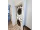 Efficient stacked washer and dryer unit in a dedicated laundry area, adding convenience to the home at 19820 N 13Th Ave # 241, Phoenix, AZ 85027