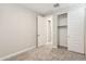 Neutrally decorated bedroom with door to bathroom and large closet at 21052 N 58Th St, Phoenix, AZ 85054