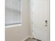 Bright entryway featuring a white door with modern hardware and a window with horizontal blinds at 21052 N 58Th St, Phoenix, AZ 85054