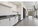 Elegant hallway wet bar area with white cabinets and modern fixtures and wine fridge at 21052 N 58Th St, Phoenix, AZ 85054