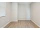 An empty room featuring neutral walls and wood-look tile flooring at 21052 N 58Th St, Phoenix, AZ 85054