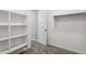 Walk-in closet with shelves, closet rod, and neutral carpet at 21052 N 58Th St, Phoenix, AZ 85054