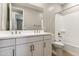 Bright bathroom features double sinks, a large mirror, and a shower-tub combination at 21056 N 58Th St, Phoenix, AZ 85054