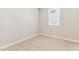 Empty room features neutral paint color, carpet floors, baseboards, and window with blinds at 21056 N 58Th St, Phoenix, AZ 85054