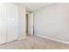 Bedroom boasts modern doors, neutral paint color, carpet floors, and plenty of closet space at 21056 N 58Th St, Phoenix, AZ 85054