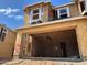 New construction home featuring a garage, windows with Tyvek wrap, and wood framing under a clear blue sky at 21056 N 58Th St, Phoenix, AZ 85054